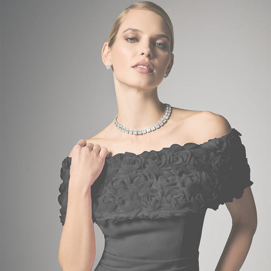 model in black off the shoulder gown with diamond necklace